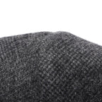 Charcoal tweed-style wool coat fabric close-up