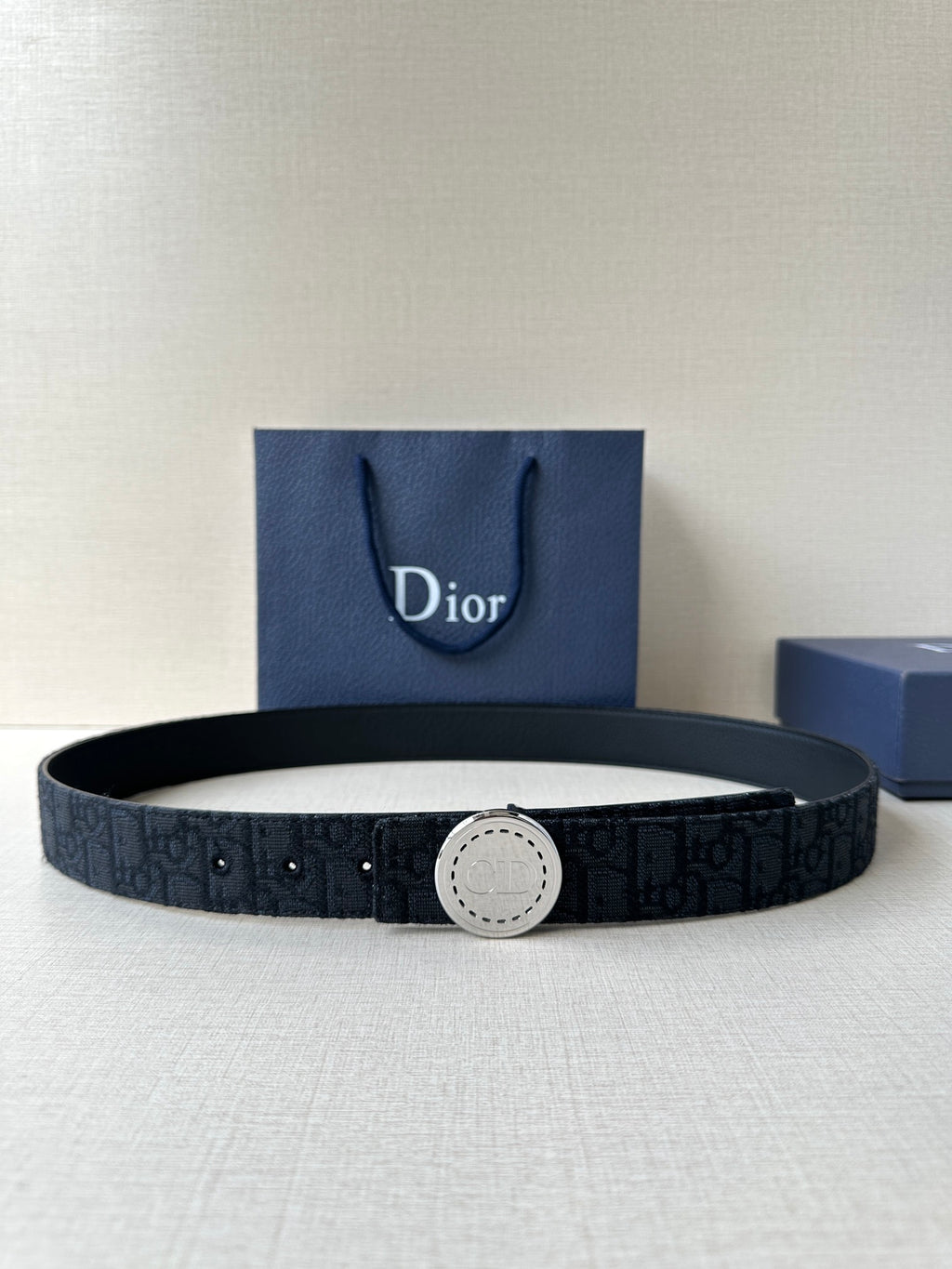 Dior belt with dark monogram webbing and round silver-tone buckle