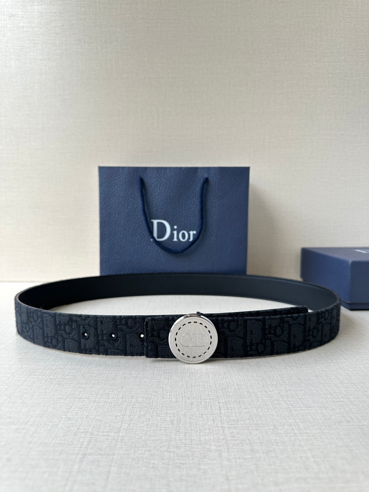 Dior belt with dark monogram webbing and round silver-tone buckle