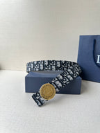 Logo-print belt with tan round buckle, black-and-white patterned strap