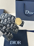 Logo-print belt with gold-tone round buckle, black-and-white patterned strap