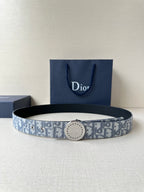 Dior belt with blue-gray monogram pattern and round metal buckle on dark strap