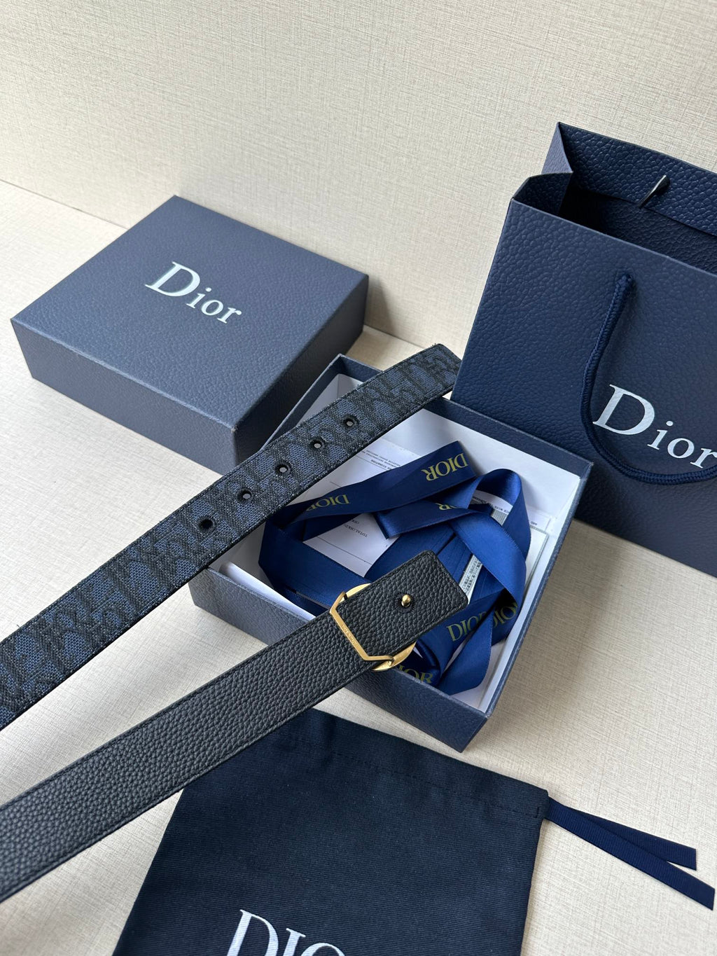 Navy Dior belt with gold-tone buckle and monogram strap in a box set
