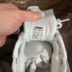 White sneaker size label inside with user guide text and size markings