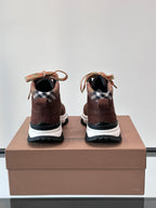 Back view of brown high-top sneakers with plaid heel lining and white rubber sole