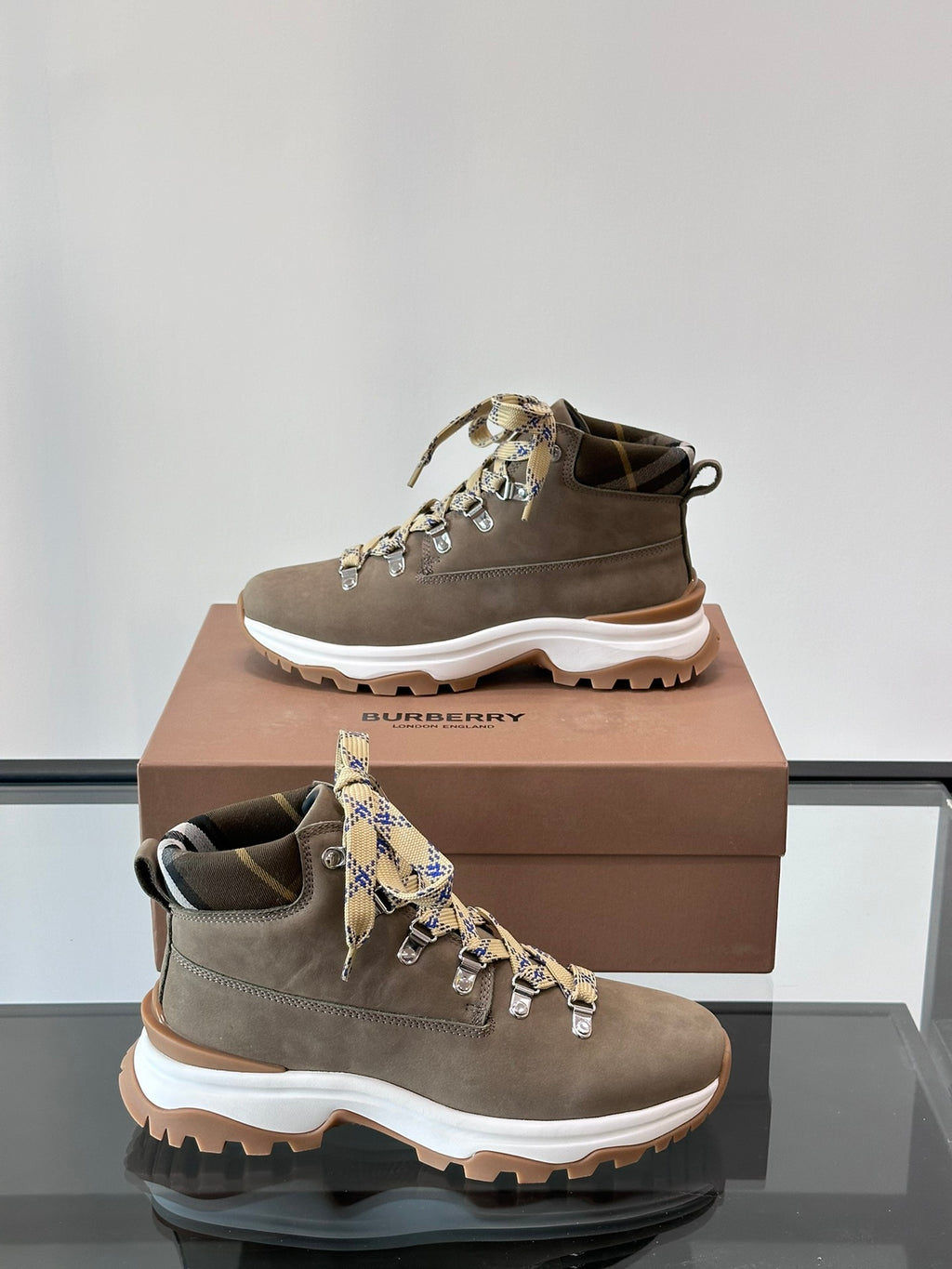 Pair of Burberry lace-up boots with check ribbon laces, dark taupe suede, white rugged sole