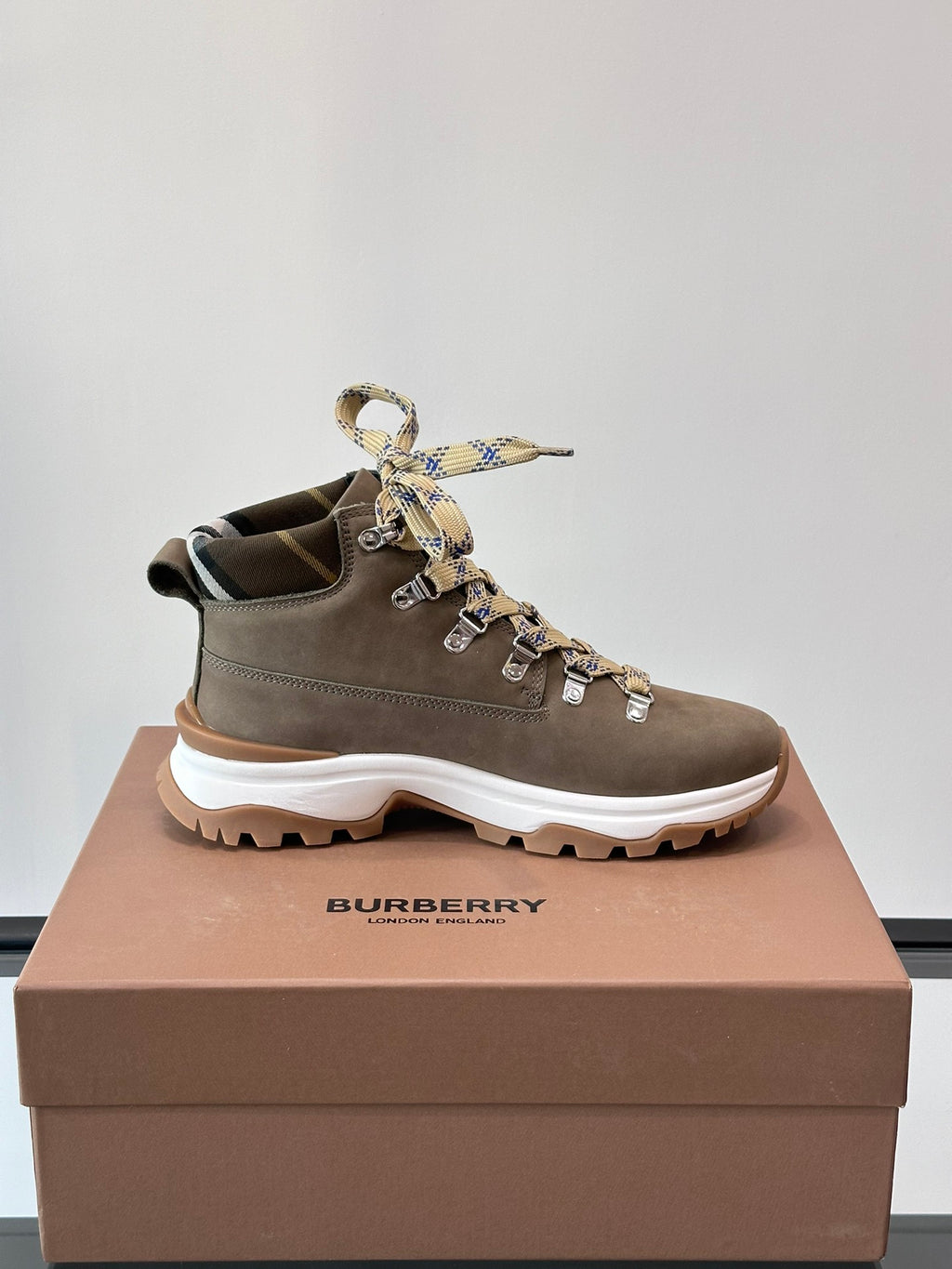Burberry lace-up boot with check ribbon bow on laces, dark taupe suede and chunky white sole