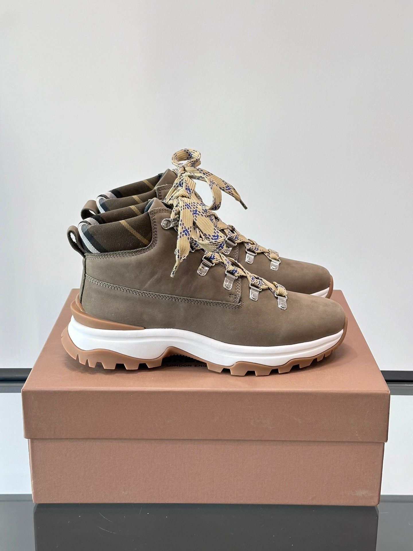 Burberry lace-up boot with check ribbon ties, dark taupe suede upper, chunky white sole