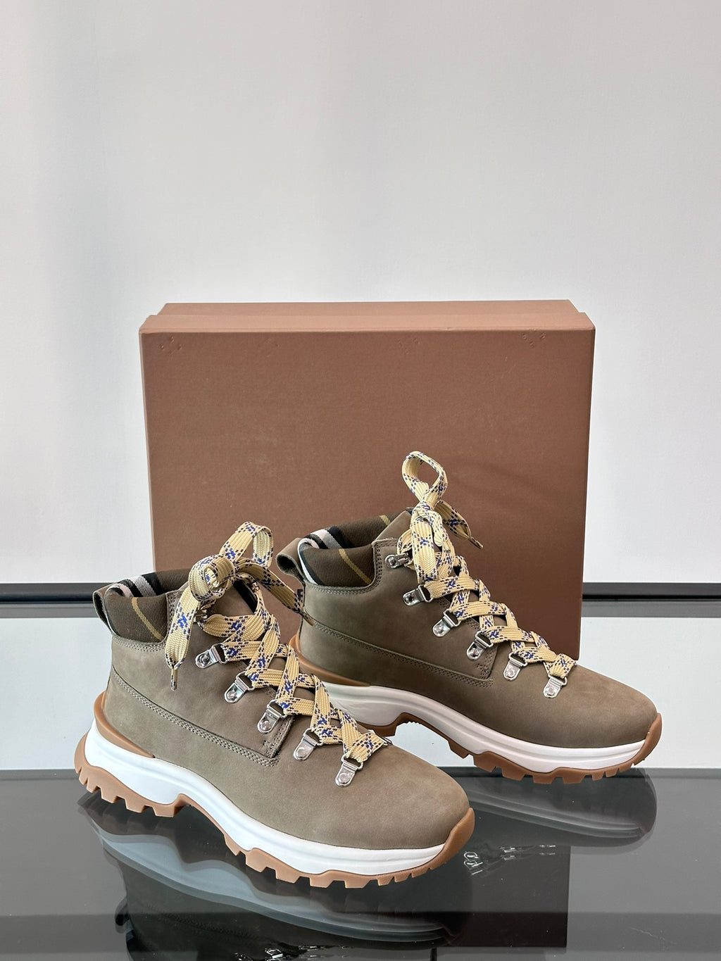 Burberry lace-up boot with check ribbon bow accents, dark taupe suede, white outsole