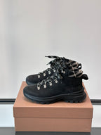 Black high-top lace-up boot with plaid collar and rugged treaded rubber sole