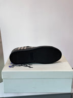 Burberry sneakers sole view, black outsole with check upper edges
