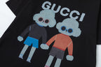 Black Gucci T-shirt front close-up featuring GUCCI text and two bear characters