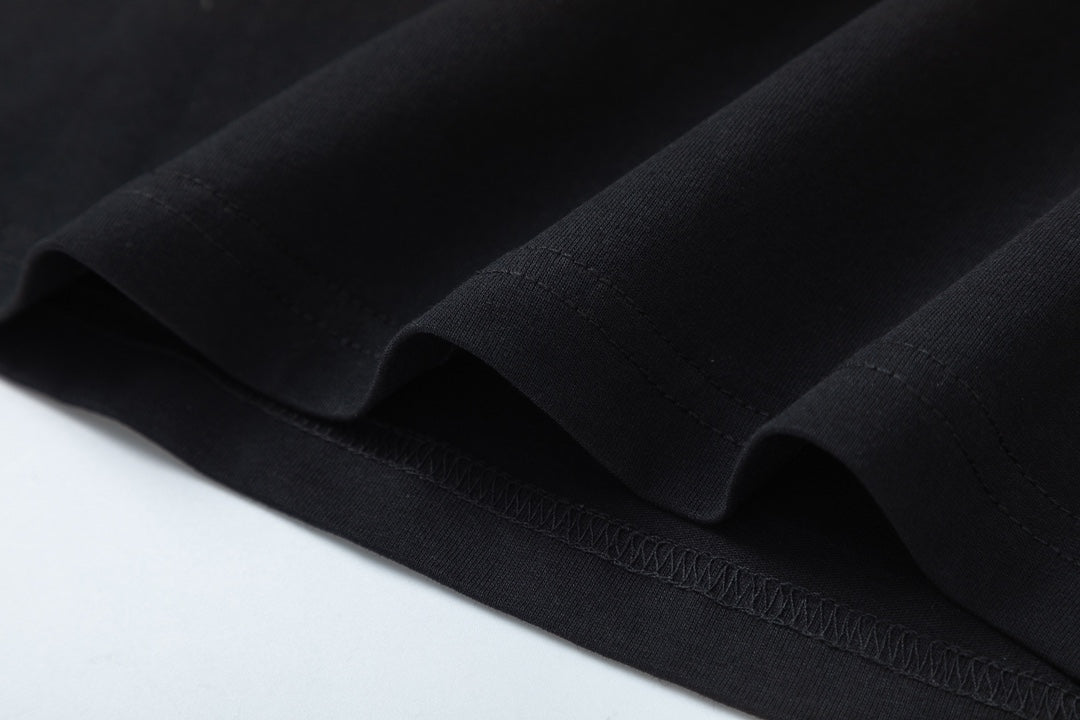 Black Gucci T-shirt fabric fold with visible stitching at hem