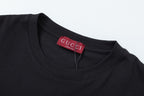 Black Gucci T-shirt neckline with red brand label inside crew collar