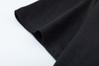 Black Gucci T-shirt hem and side seam close-up