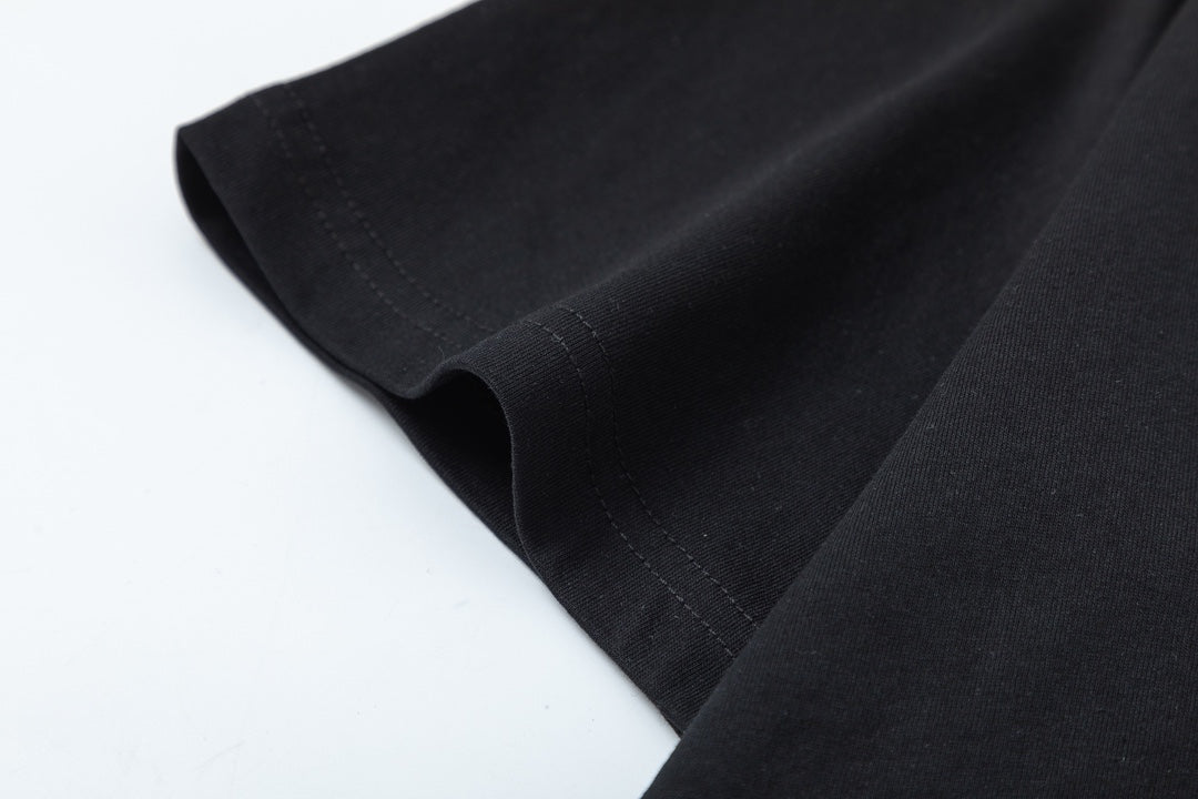 Black Gucci T-shirt hem and side seam close-up