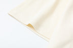 Cream T-shirt sleeve and side hem with stitched edge