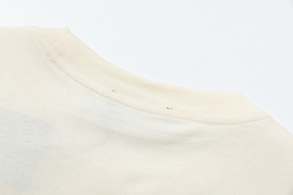 Cream T-shirt neckline seam and ribbed crew collar