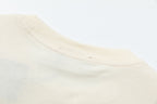 Cream T-shirt neckline seam and ribbed crew collar
