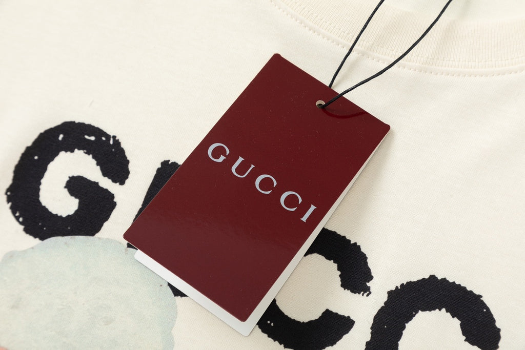 Gucci T-shirt with red hang tag and partial bear graphic