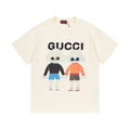 Cream Gucci T-shirt with bear cartoon graphic and multicolor lettering