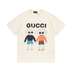 Cream Gucci T-shirt with bear cartoon graphic and multicolor lettering