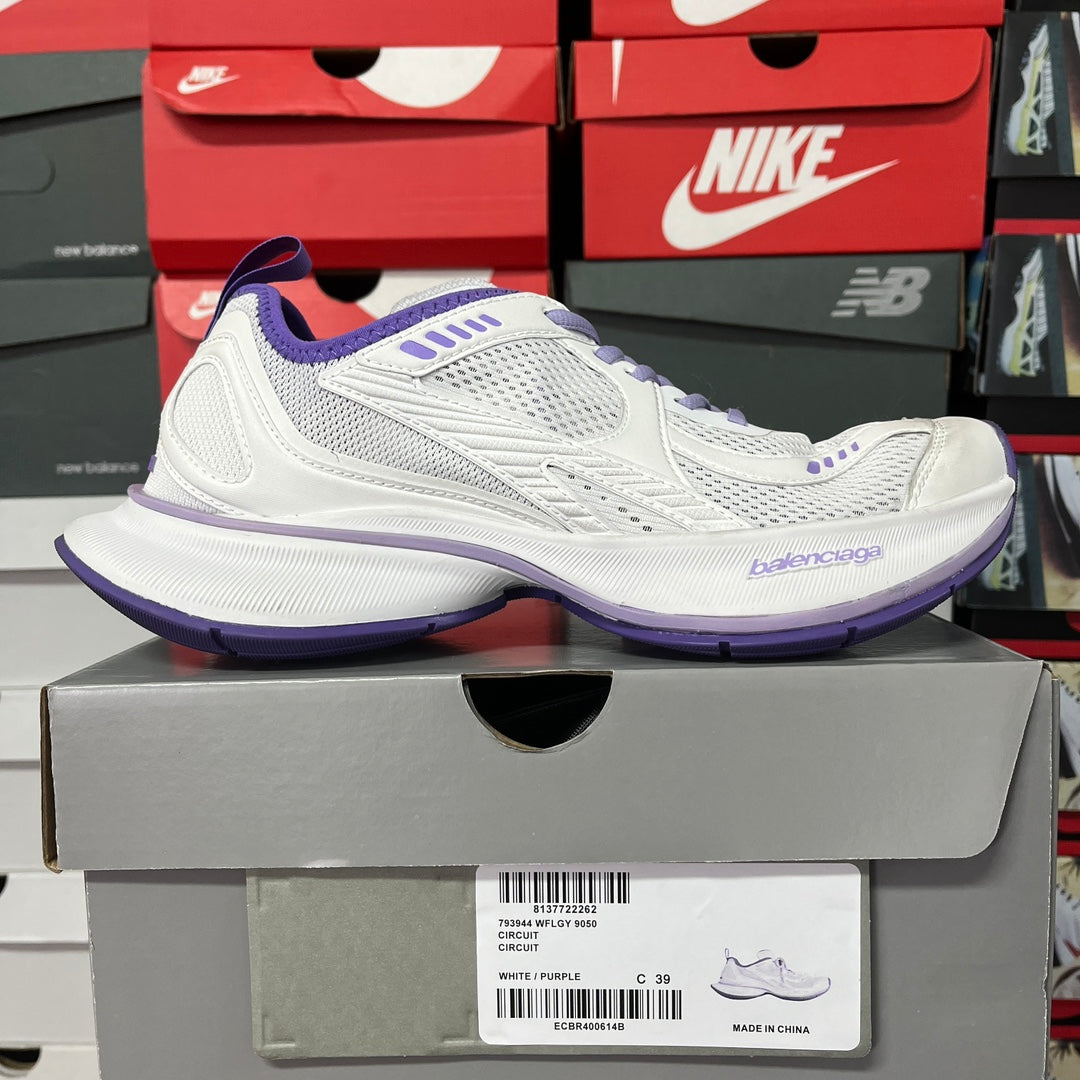 White and purple Balenciaga lace-up sneaker on box, mesh upper and purple trim
