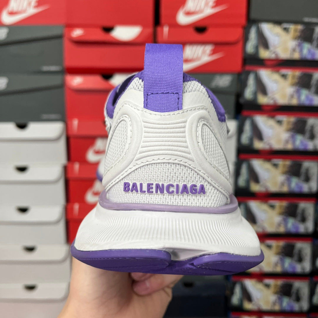 White Balenciaga high-sole sneaker heel view with purple text on back