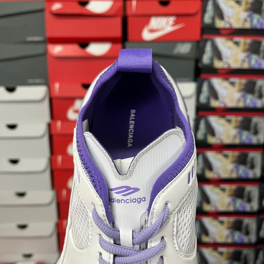 White Balenciaga sneaker back view with purple collar and heel pull tab