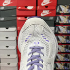 White Balenciaga sneaker toe view with purple laces, lace cage, and mesh panels