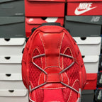 Red mesh sneaker upper with elastic straps and metal lace eyelets