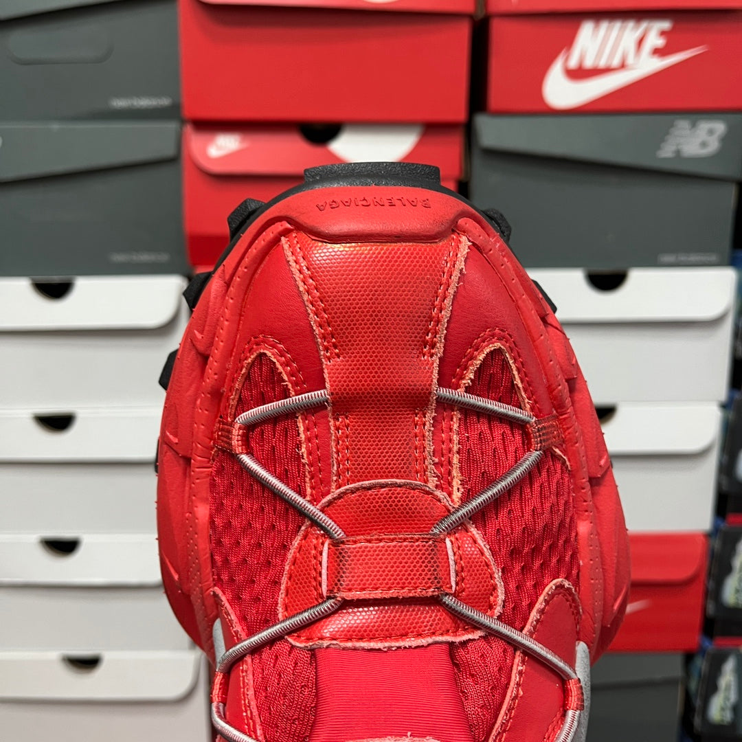 Red mesh sneaker upper with elastic straps and metal lace eyelets