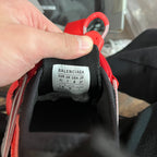 Balenciaga size label on black-and-red sneaker tongue, inside view