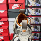 Balenciaga sneakers heel view with padded collar and orange interior lining.