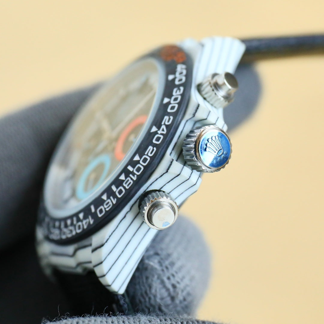 Rolex Daytona watch case side with crown and blue accent button.