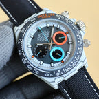 Rolex Daytona watch with white dial, black bezel, and orange and blue subdials.