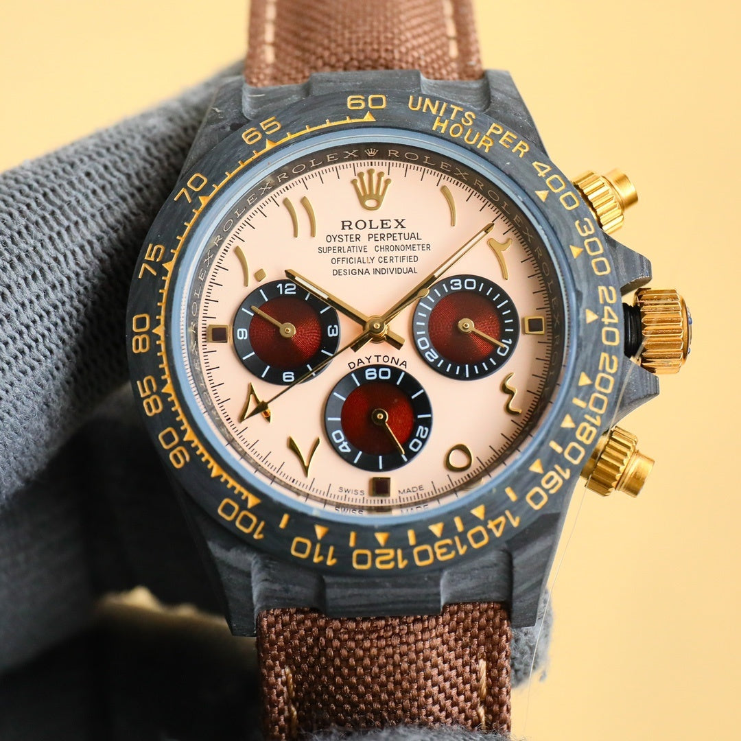 Rolex Daytona watch with champagne dial, brown fabric strap, and gold-tone pushers.