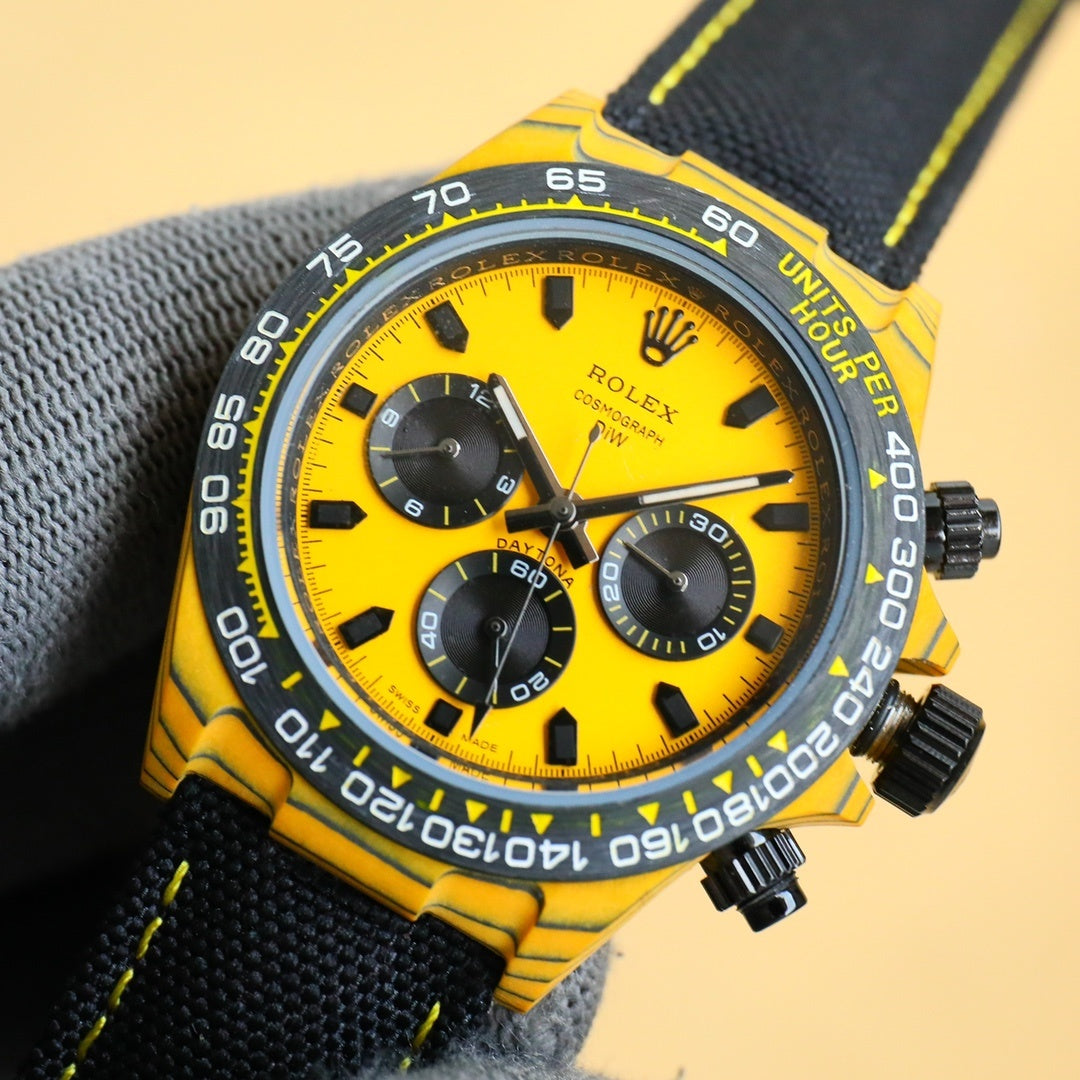 Rolex chronograph watch with yellow dial, yellow bezel, stainless case, black fabric strap