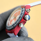 Rolex watch side profile with red bezel, crown and pushers, stainless case
