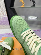 Green Louis Vuitton high-top sneaker toe view with perforated texture and white laces