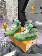 Pair of green Louis Vuitton high-top sneakers with white laces on display box