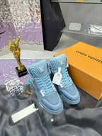 Light blue high-top sneakers with embossed side logos and teal lace ties