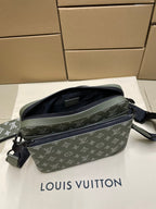 Louis Vuitton crossbody bag angled view with monogram pattern and top zipper
