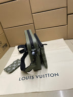 Louis Vuitton crossbody bag shown from side, monogram canvas and strap attachment