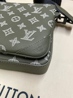 Louis Vuitton bag close-up of corner stitching and monogram print in dark olive
