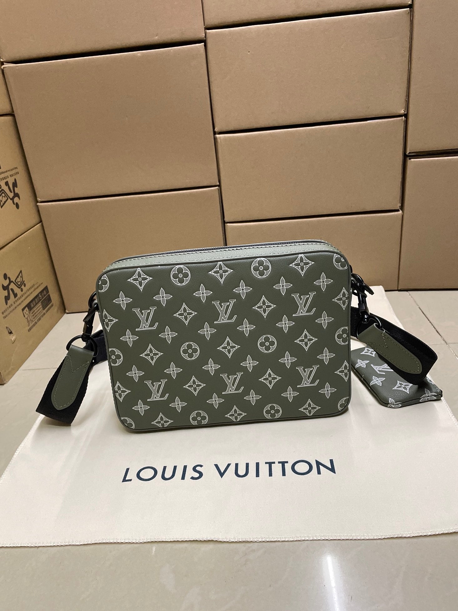 Louis Vuitton crossbody bag, gray-olive monogram print, side strap loops