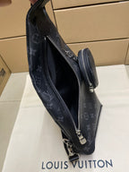 Dark monogram sling bag with side zip and adjustable crossbody strap