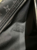 Bag interior lining with zipper track and stitched leather patch