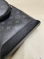 Textured monogram bag trim with grained leather edge