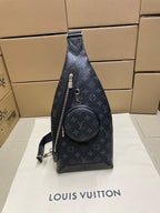 Dark monogram sling bag with front zip pocket and round mini pouch
